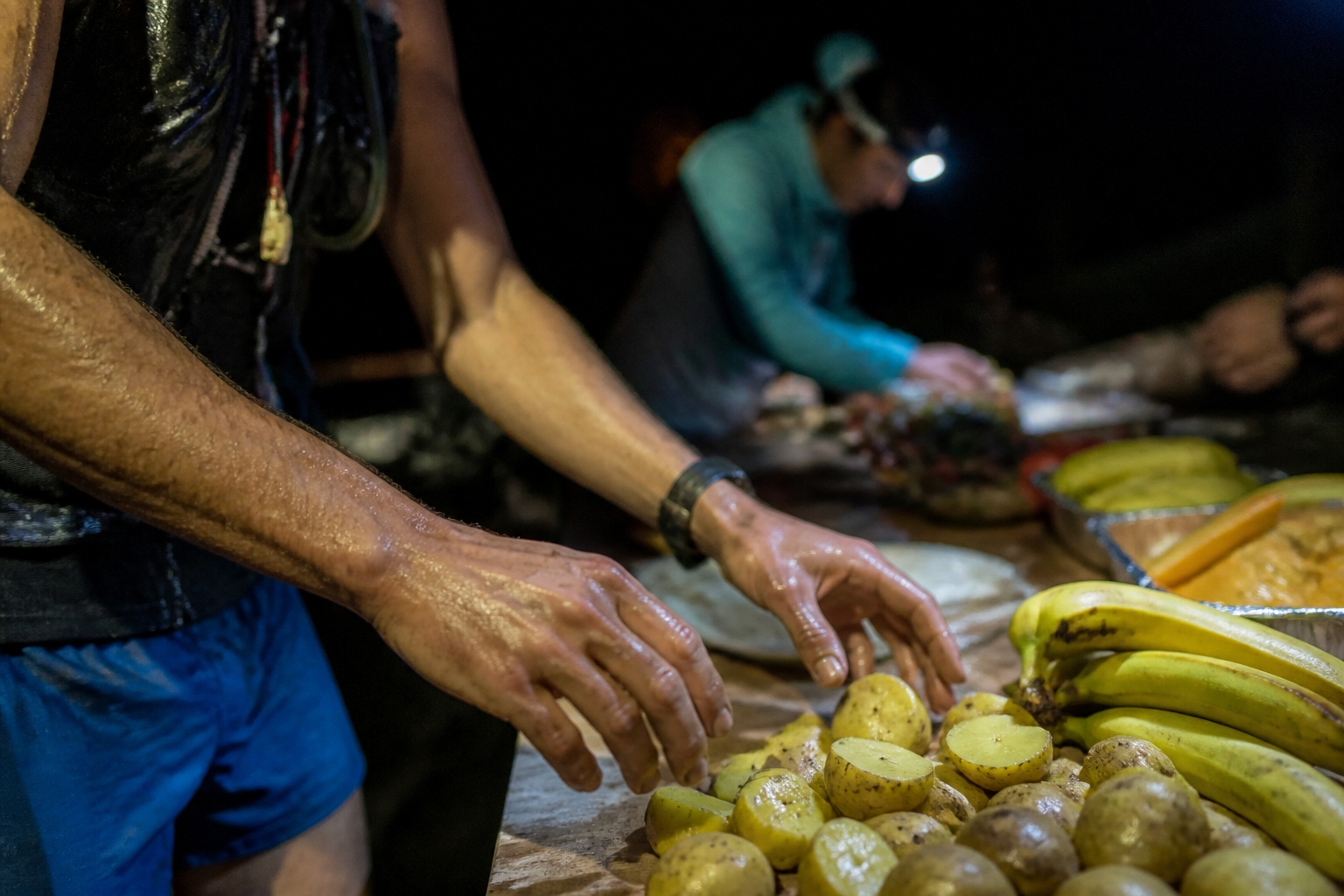 Ultra-trail endurance athlete fueling on alpine ridge - BananaGO Pocket Banana
